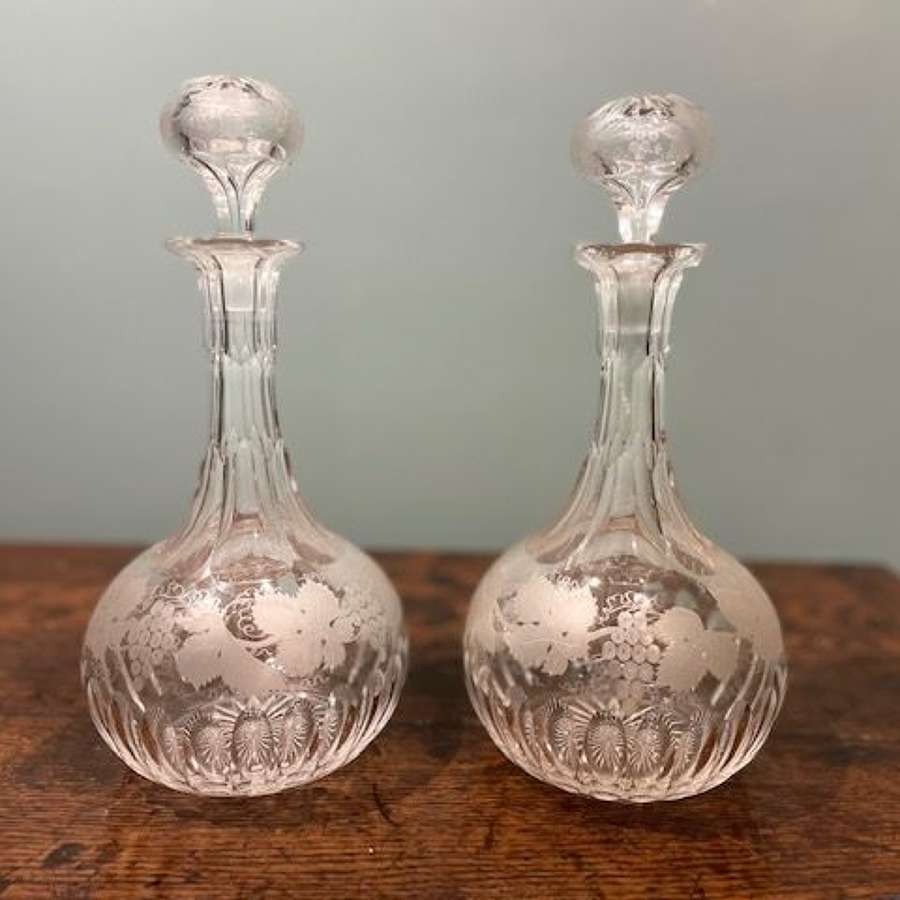 Pair of mid 19th c. Shaft & Globe decanters with grapevine motifs